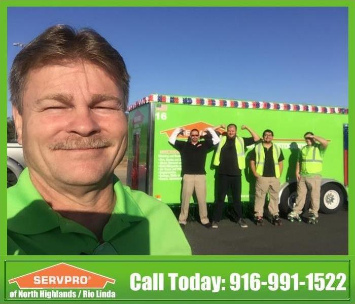 SERVPRO of North Highlands / Rio Linda employees getting ready for local Rio Linda Parade. Smiling and being funny for photo.
